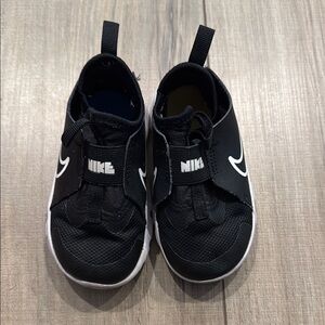 Nike Black Sneakers with Mesh Upper and Pull Tabs